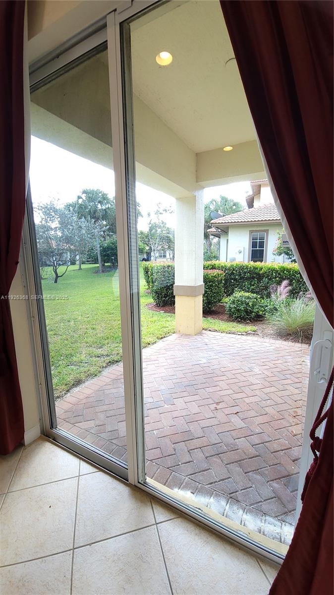 6033 Northwest 118th Drive, Unit 6033 Coral Springs, FL 33076 - Photo 14 of 43 a view of a porch of the house