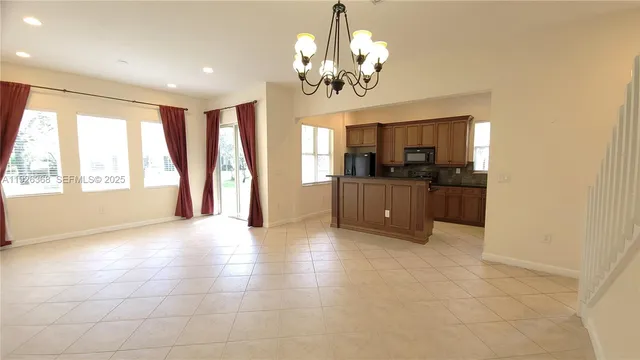a view of a kitchen with a sink and cabinets