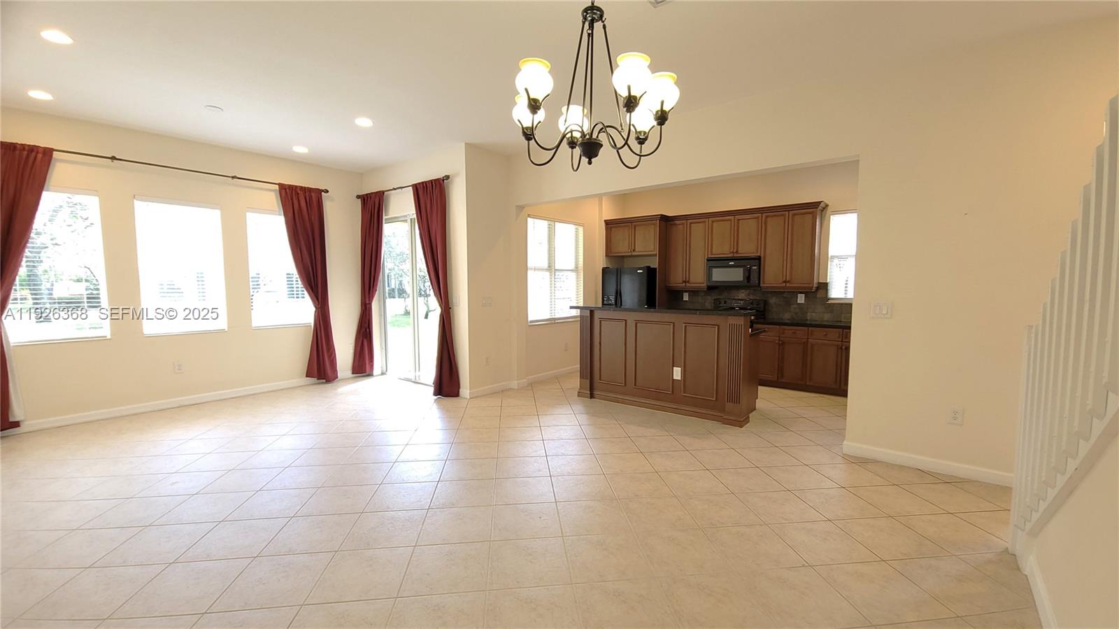 6033 Northwest 118th Drive, Unit 6033 Coral Springs, FL 33076 - Photo 2 of 43 a view of a kitchen with a sink and cabinets