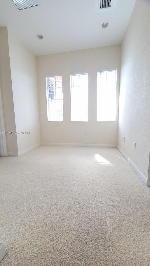 6033 Northwest 118th Drive, Unit 6033 Coral Springs, FL 33076 - Photo 22 of 43 an empty room with a window