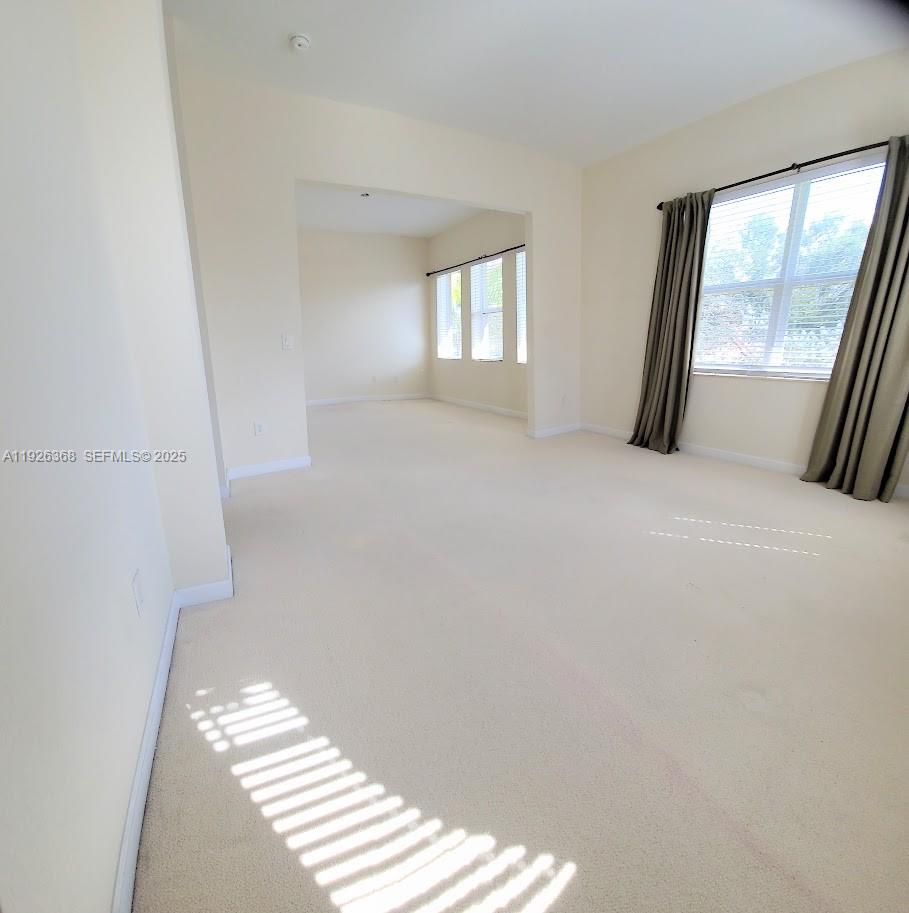 6033 Northwest 118th Drive, Unit 6033 Coral Springs, FL 33076 - Photo 23 of 43 a view of an empty room and window