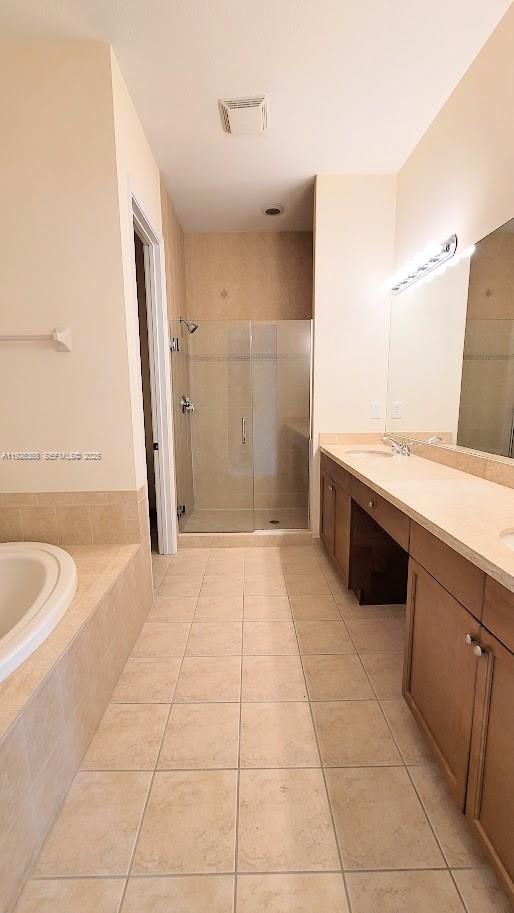 6033 Northwest 118th Drive, Unit 6033 Coral Springs, FL 33076 - Photo 31 of 43 a spacious bathroom with a granite countertop sink a toilet and a bathtub
