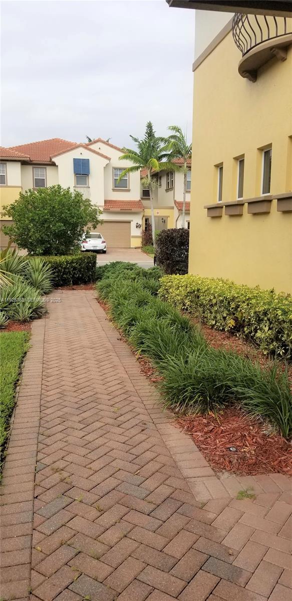 6033 Northwest 118th Drive, Unit 6033 Coral Springs, FL 33076 - Photo 34 of 43 a view of a street with an ocean view