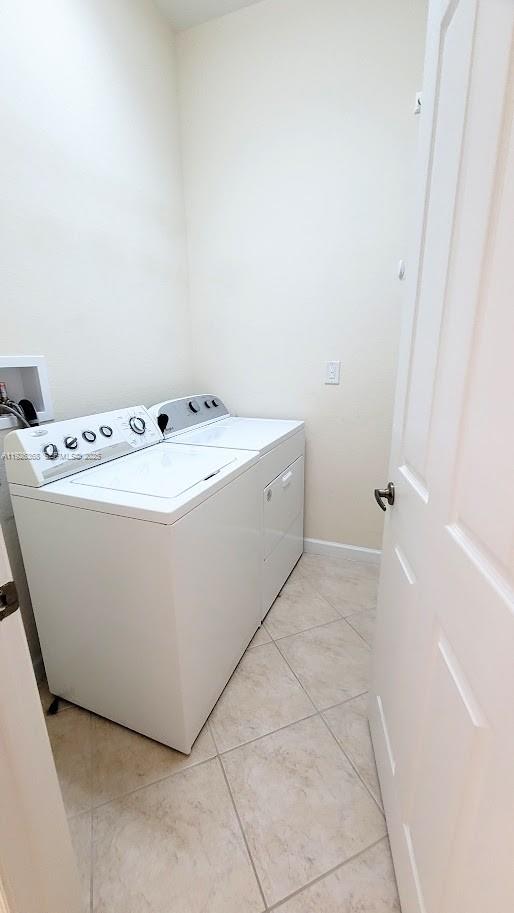6033 Northwest 118th Drive, Unit 6033 Coral Springs, FL 33076 - Photo 37 of 43 a utility room with dryer and washer