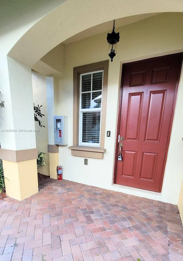 6033 Northwest 118th Drive, Unit 6033 Coral Springs, FL 33076 - Photo 38 of 43 a view of an entryway with front door