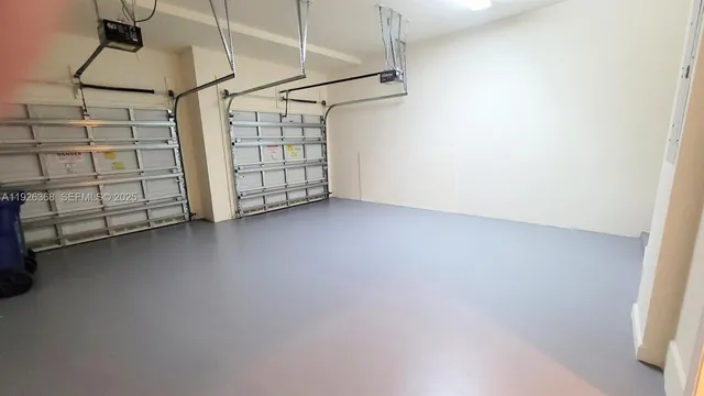 a view of a house with a yard and palm trees