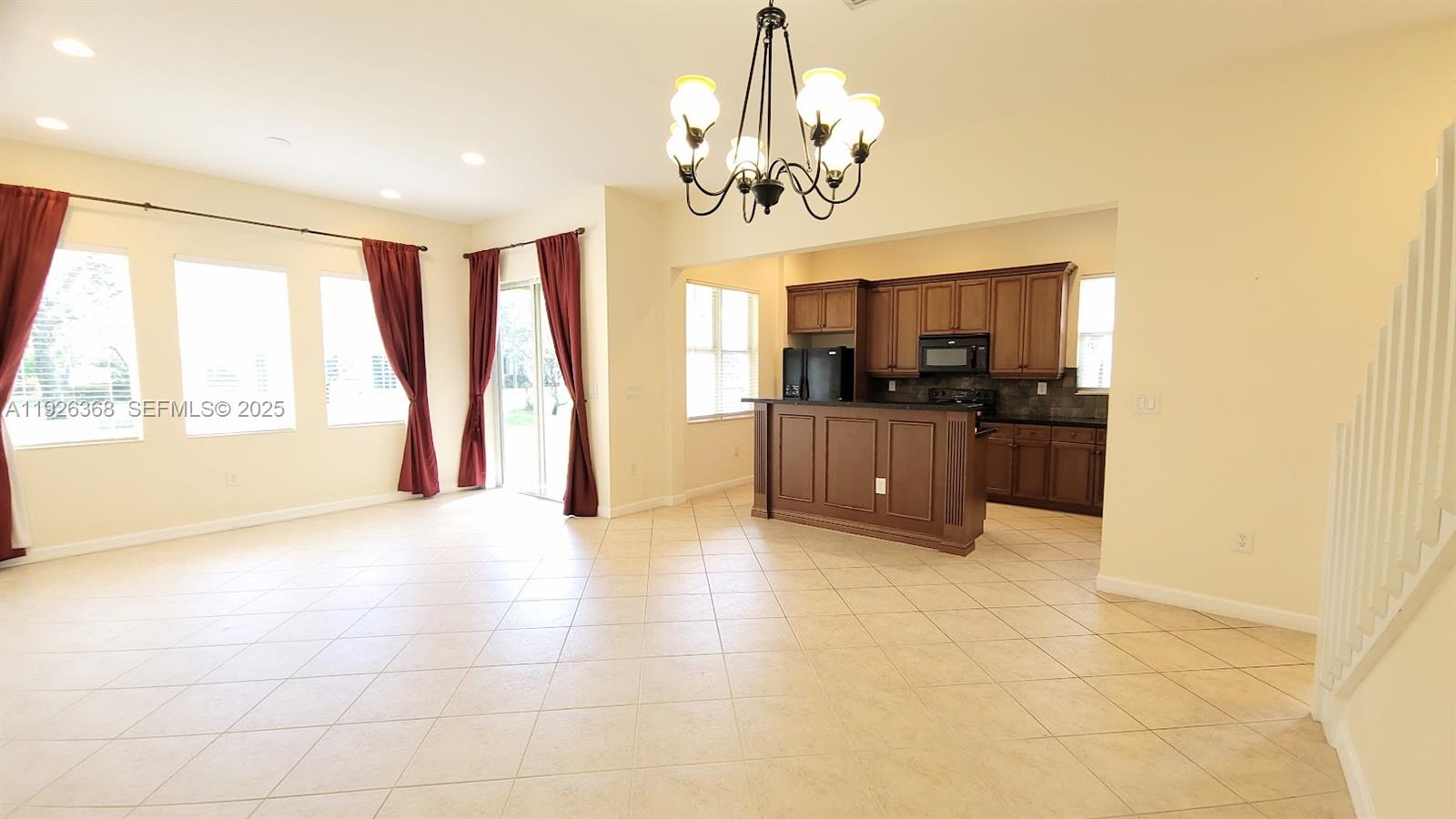 6033 Northwest 118th Drive, Unit 6033 Coral Springs, FL 33076 - Photo 10 of 43 a view of a kitchen with a sink and cabinets