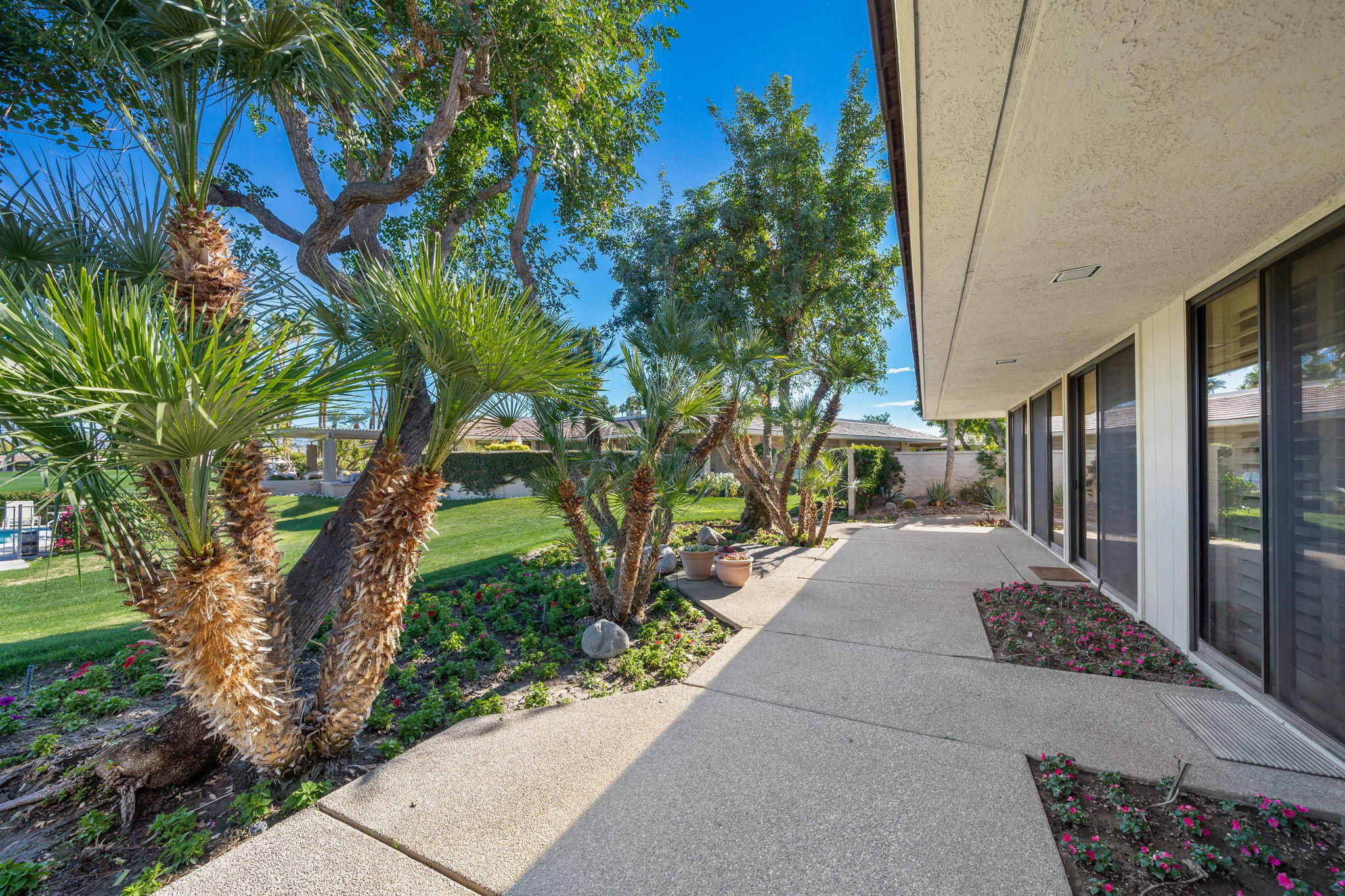 1 Hamlet Court Rancho Mirage, CA 92270 - Photo 13 of 41 a view of a pathway with a yard