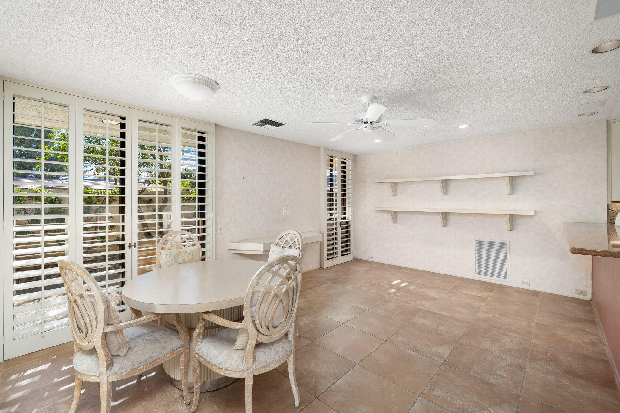 1 Hamlet Court Rancho Mirage, CA 92270 - Photo 20 of 41 a view of a dining room with furniture and window