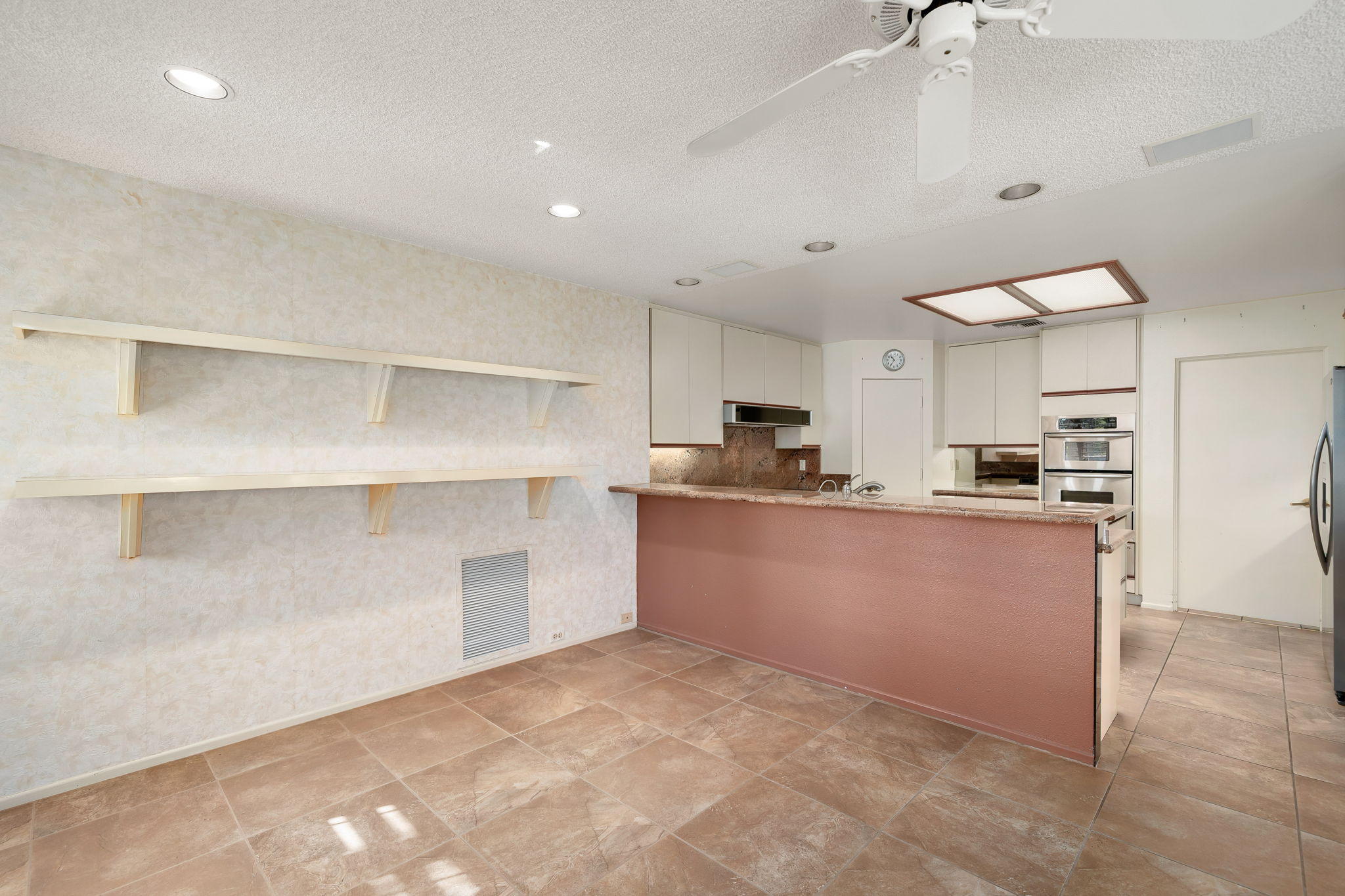 1 Hamlet Court Rancho Mirage, CA 92270 - Photo 21 of 41 a large kitchen with kitchen island a sink stainless steel appliances and cabinets