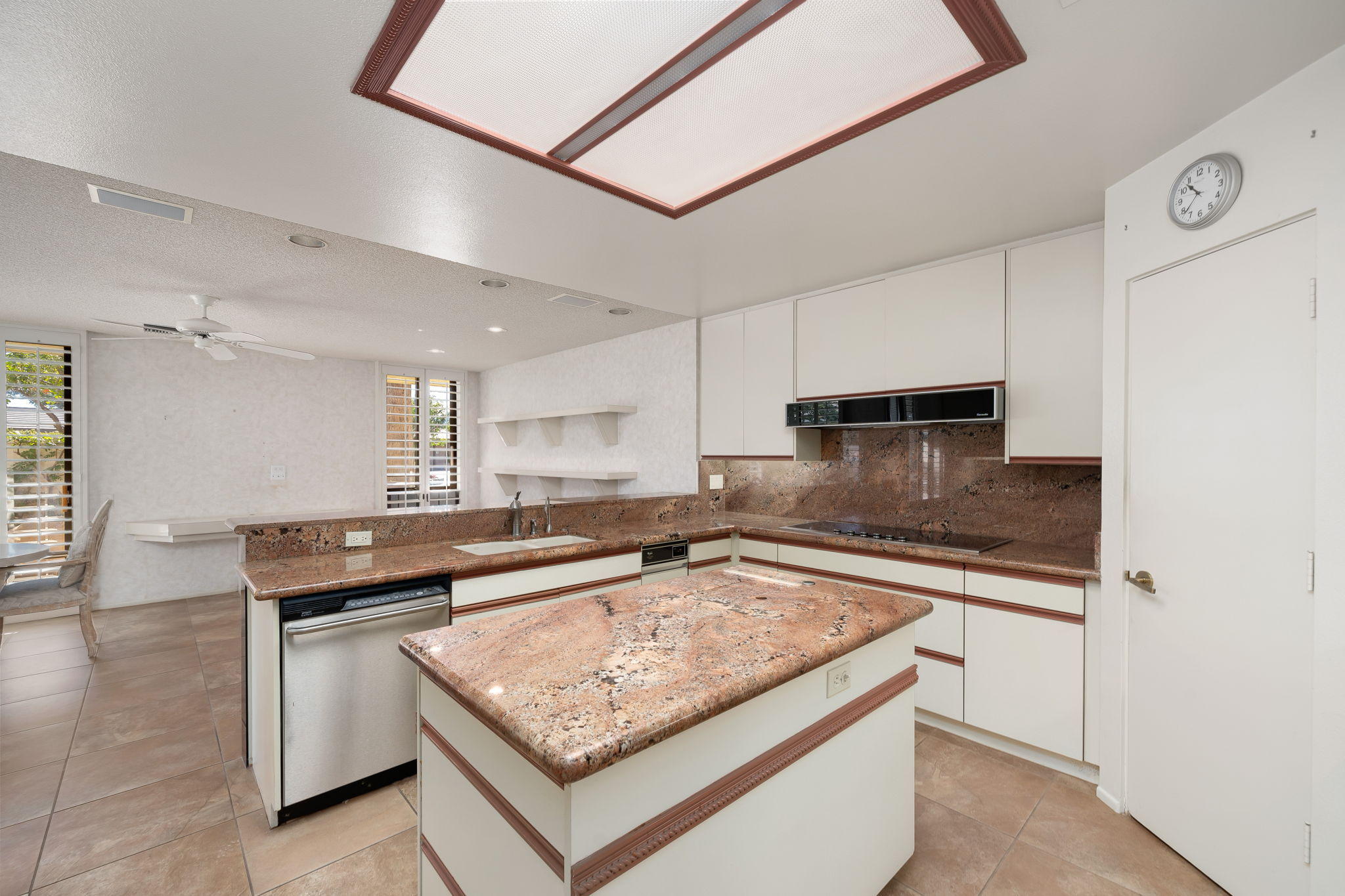 1 Hamlet Court Rancho Mirage, CA 92270 - Photo 22 of 41 a kitchen with stainless steel appliances granite countertop a sink stove and cabinets