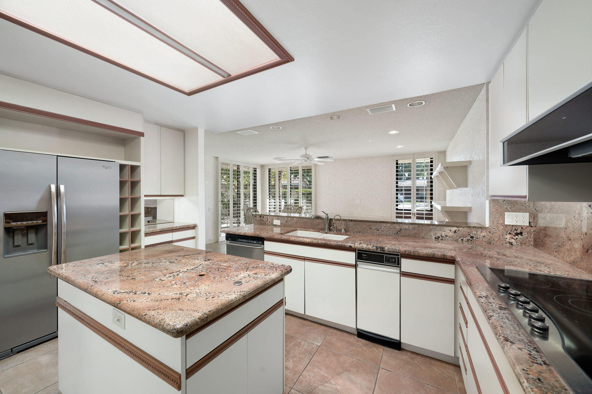 1 Hamlet Court Rancho Mirage, CA 92270 - Photo 23 of 41 a kitchen with stainless steel appliances granite countertop a sink stove and refrigerator
