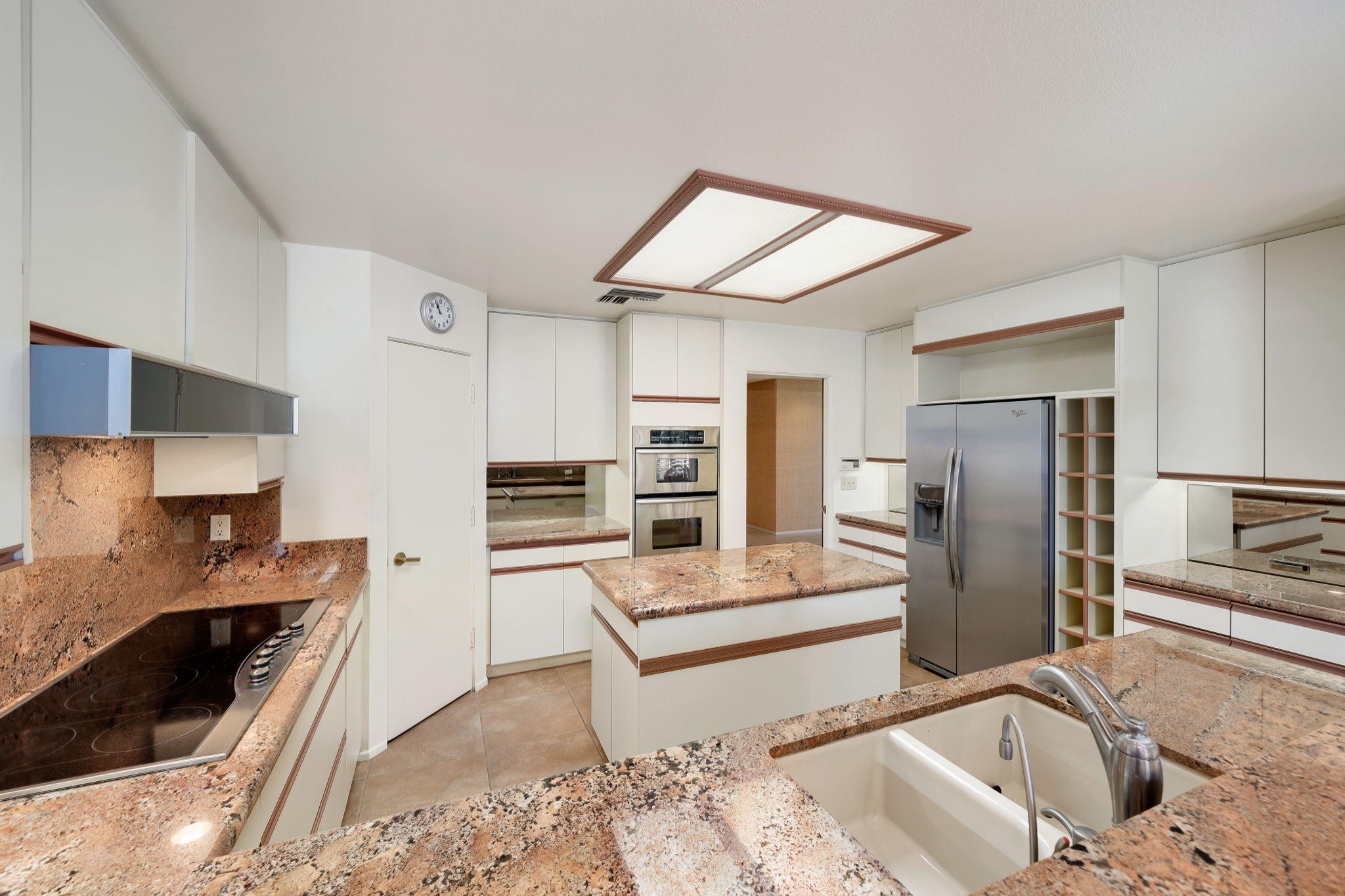 1 Hamlet Court Rancho Mirage, CA 92270 - Photo 25 of 41 a kitchen with stainless steel appliances granite countertop a sink stove and refrigerator