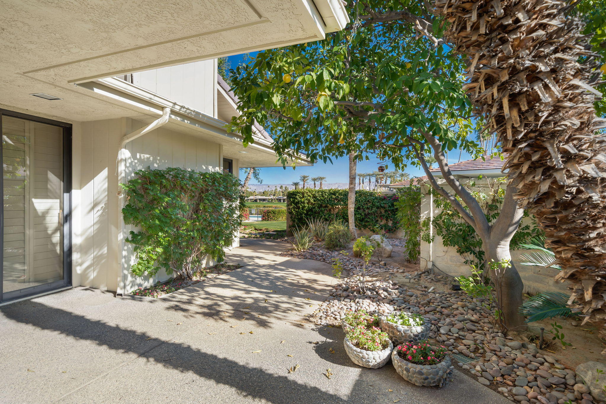 1 Hamlet Court Rancho Mirage, CA 92270 - Photo 26 of 41 a view of a back yard of the house
