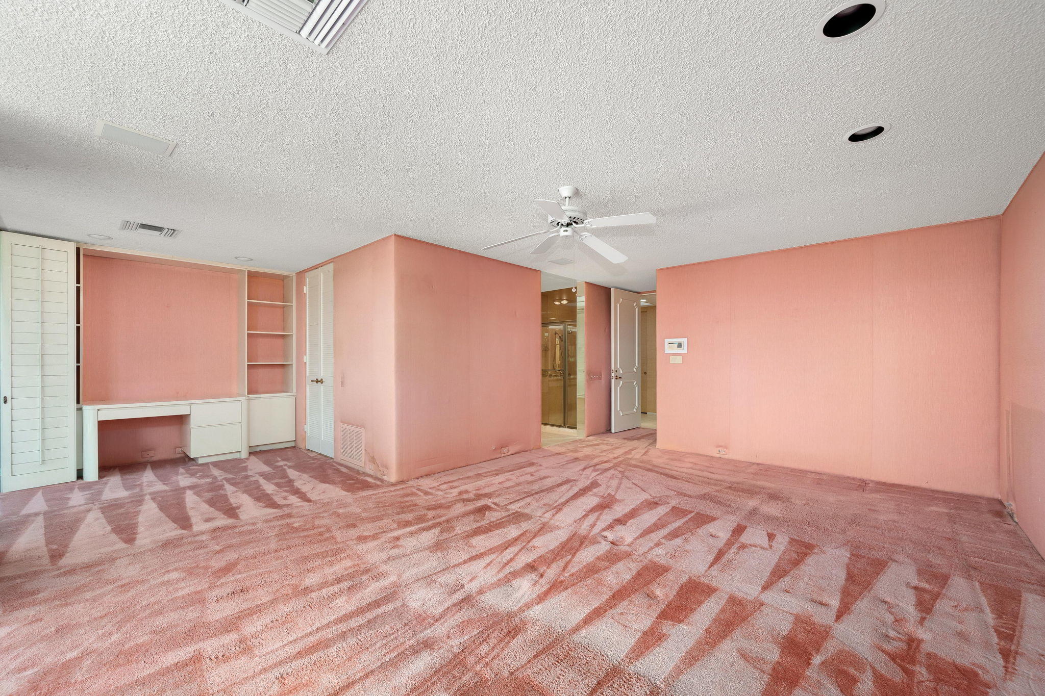 1 Hamlet Court Rancho Mirage, CA 92270 - Photo 29 of 41 a view of an empty room with window and a kitchen