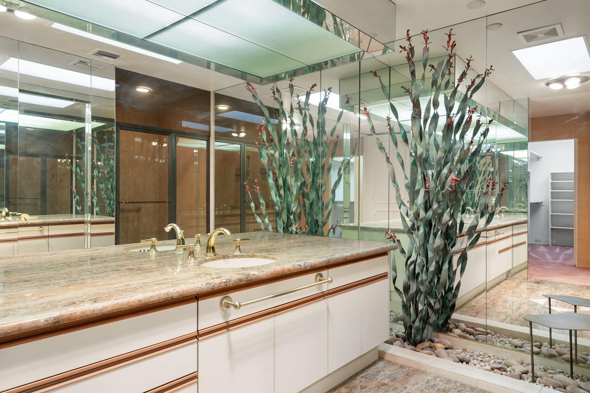 1 Hamlet Court Rancho Mirage, CA 92270 - Photo 37 of 41 a view of a sink a mirror and flower in a room
