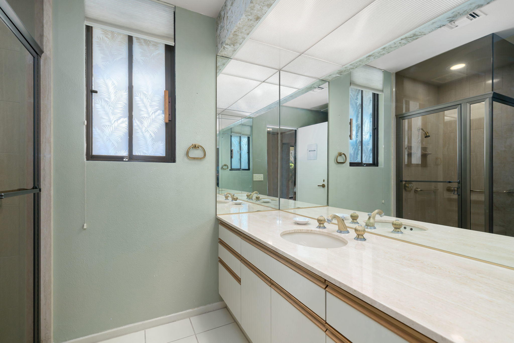1 Hamlet Court Rancho Mirage, CA 92270 - Photo 38 of 41 a bathroom with a sink and a mirror
