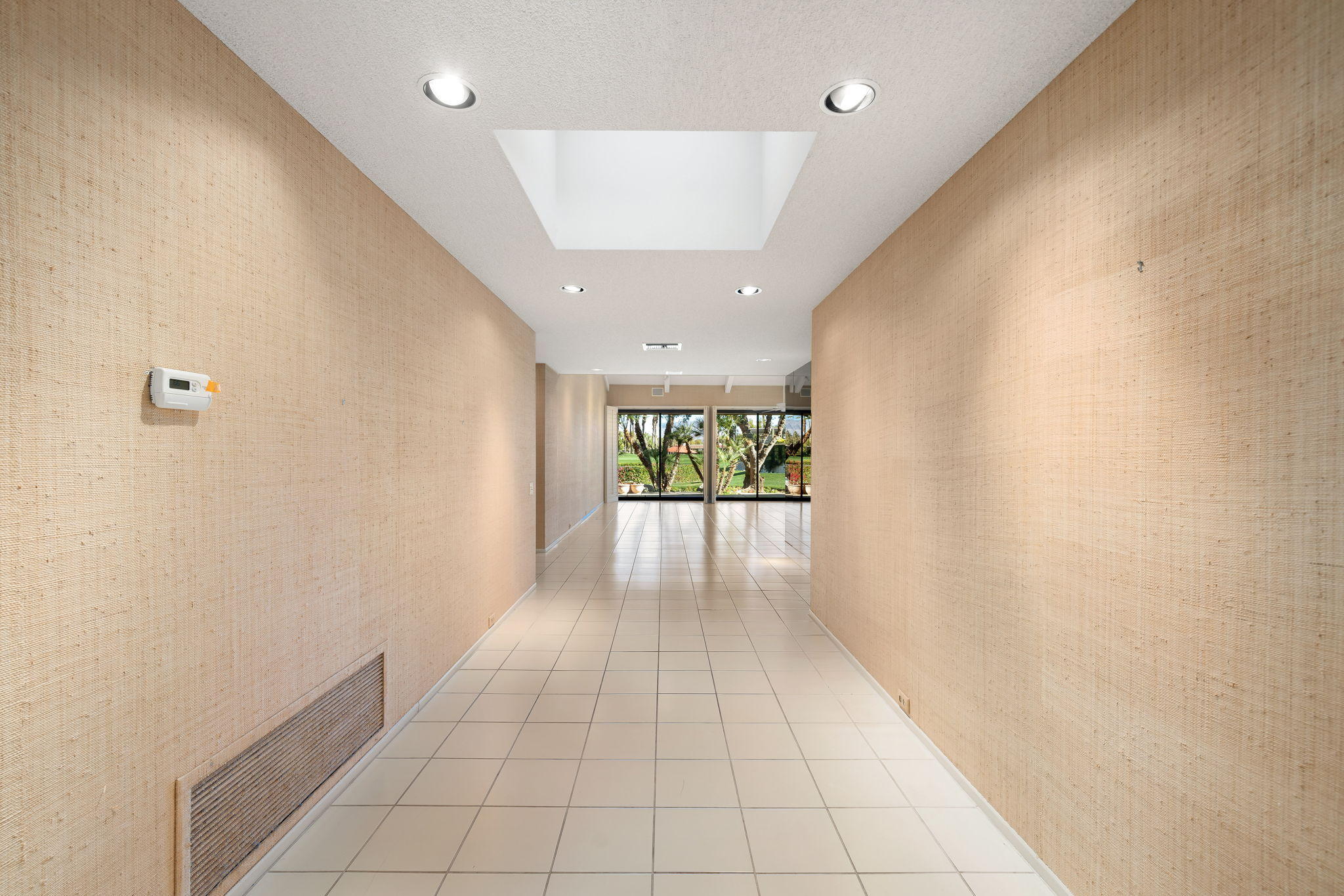 1 Hamlet Court Rancho Mirage, CA 92270 - Photo 8 of 41 a view of entryway with a window and a ceiling fan