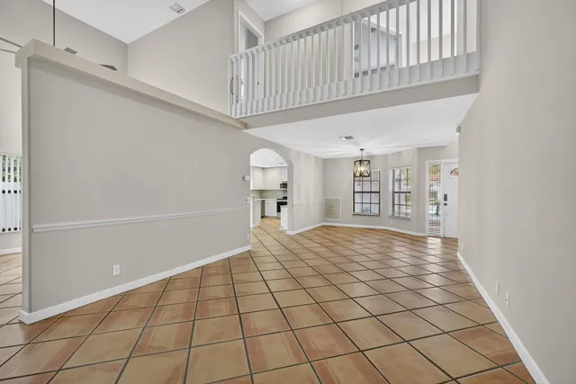 a kitchen with stainless steel appliances a refrigerator sink and microwave