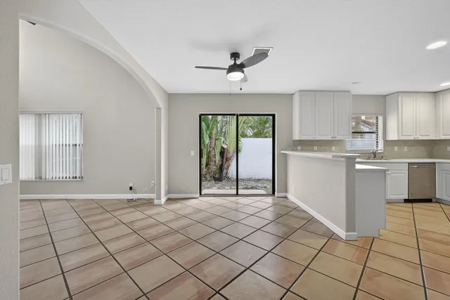 a view of kitchen with furniture wooden floor and window