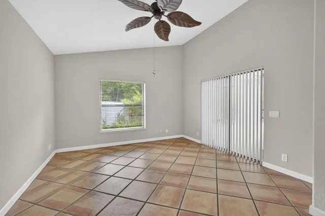 a bathroom with a toilet a sink and a window