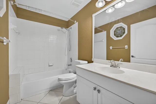 a view of a livingroom with furniture and staircase