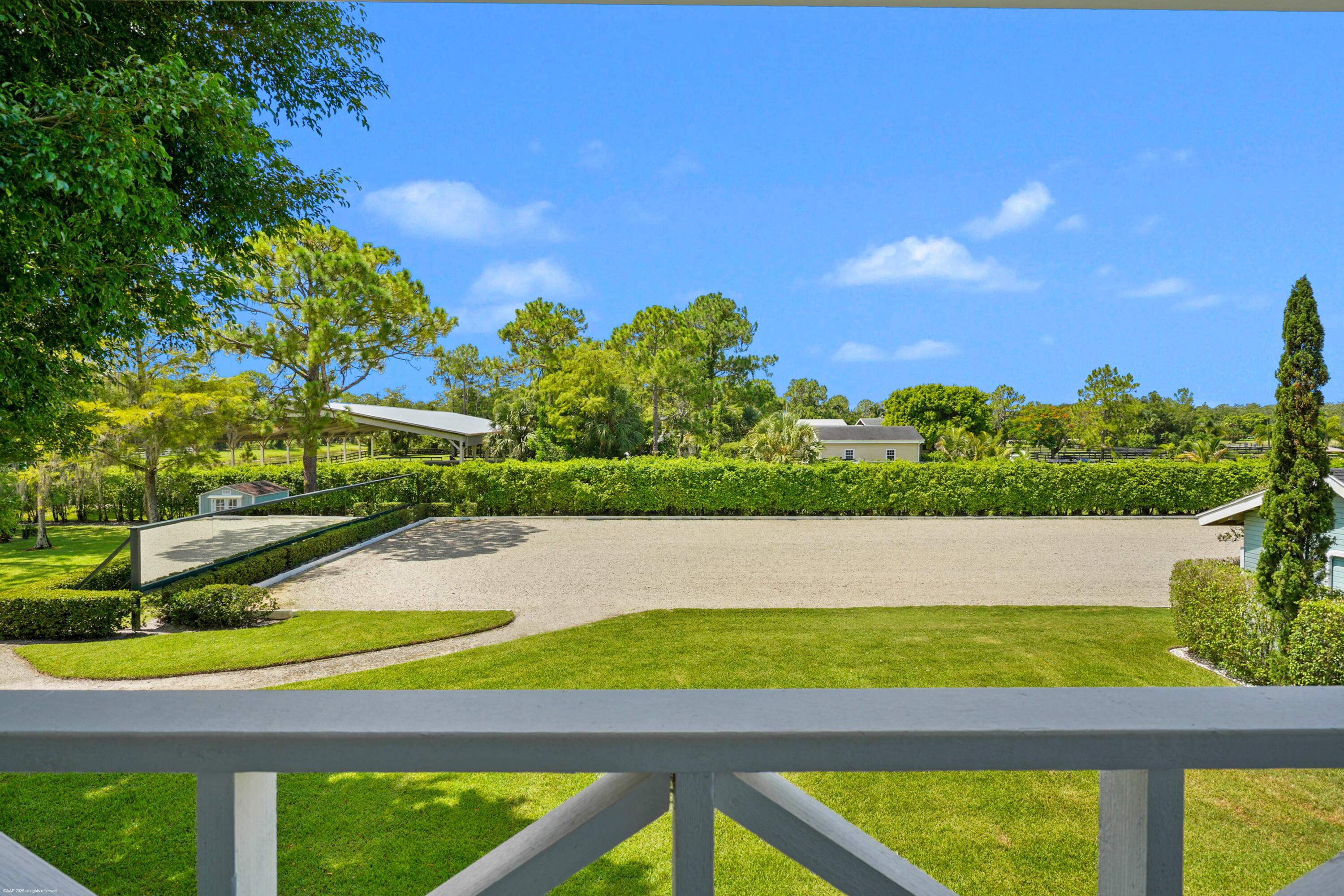 2740 Buck Ridge Trail Loxahatchee, FL 33470 - Photo 37 of 70 Third Bedroom Balcony overlooking Arena