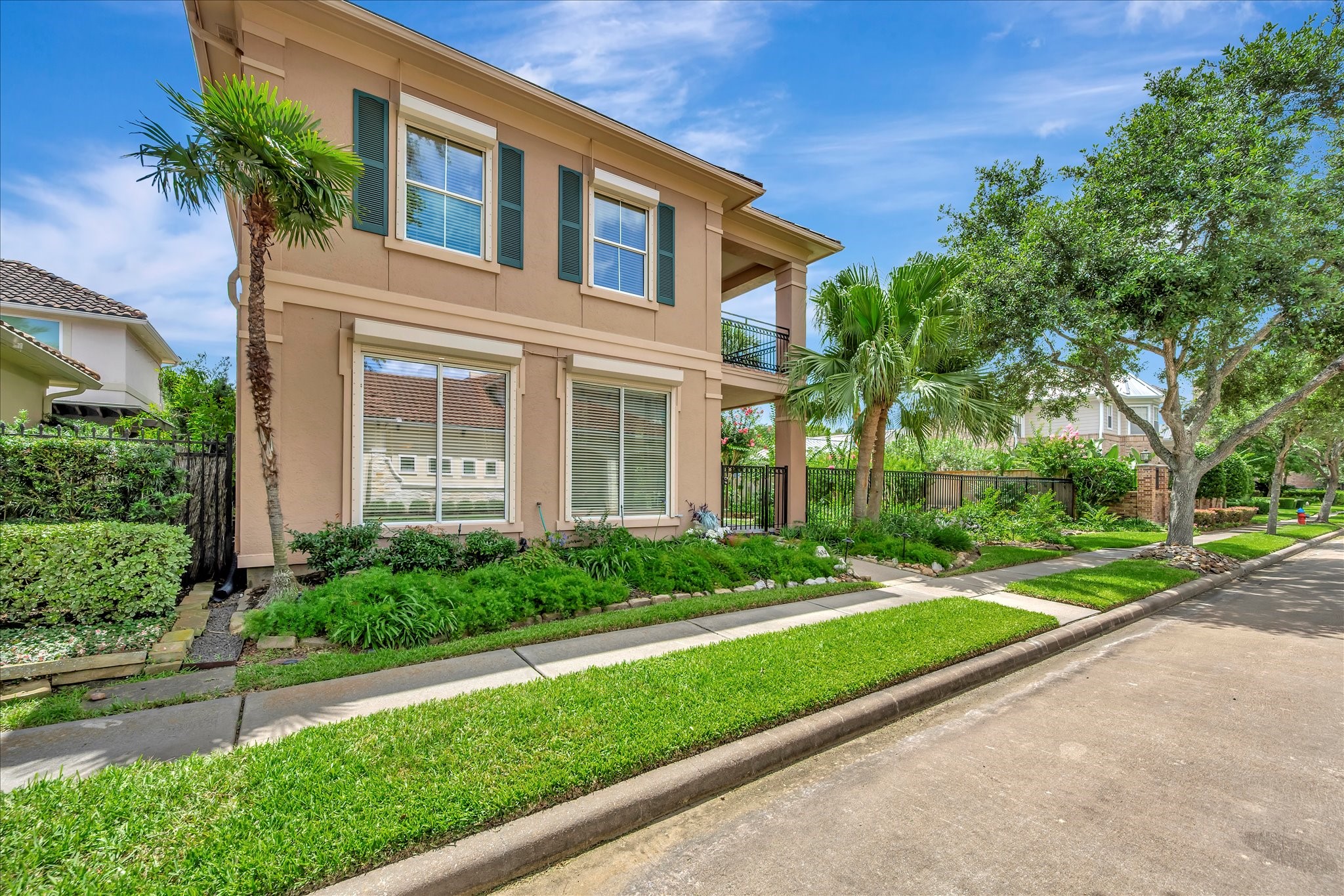 604 Harborside Way Kemah, TX 77565 - Photo 6 of 46 FRONT ELEVATION WITH HURRICANE SHUTTERS PROTECTING THE STREET FACING WINDOWS.
