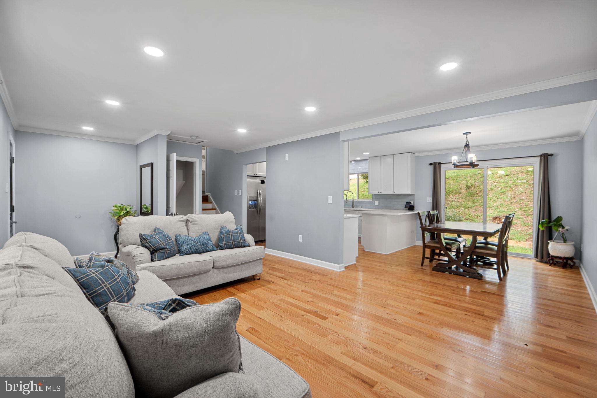 7222 Willow Oak Place Springfield, VA 22153 - Photo 15 of 34 a living room with furniture and a wooden floor