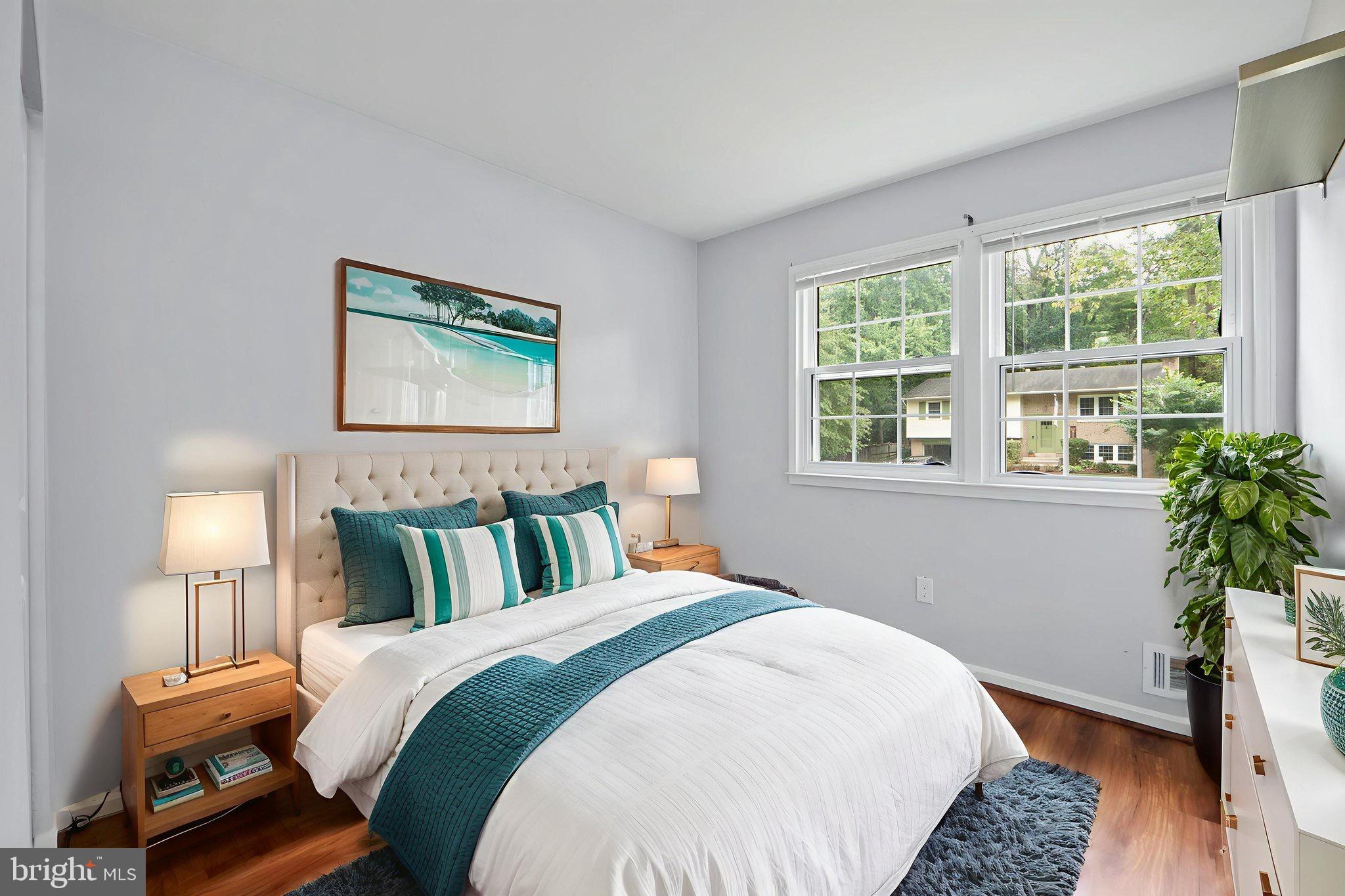 7222 Willow Oak Place Springfield, VA 22153 - Photo 22 of 34 a bedroom with bed and wooden floor