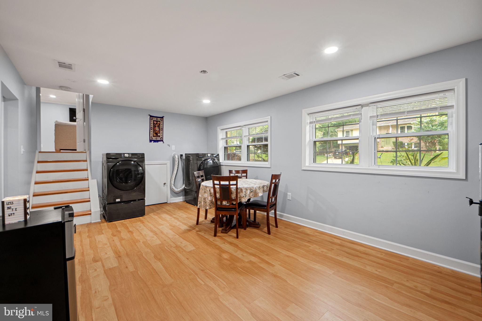 7222 Willow Oak Place Springfield, VA 22153 - Photo 26 of 34 a living room with furniture and a wooden floor