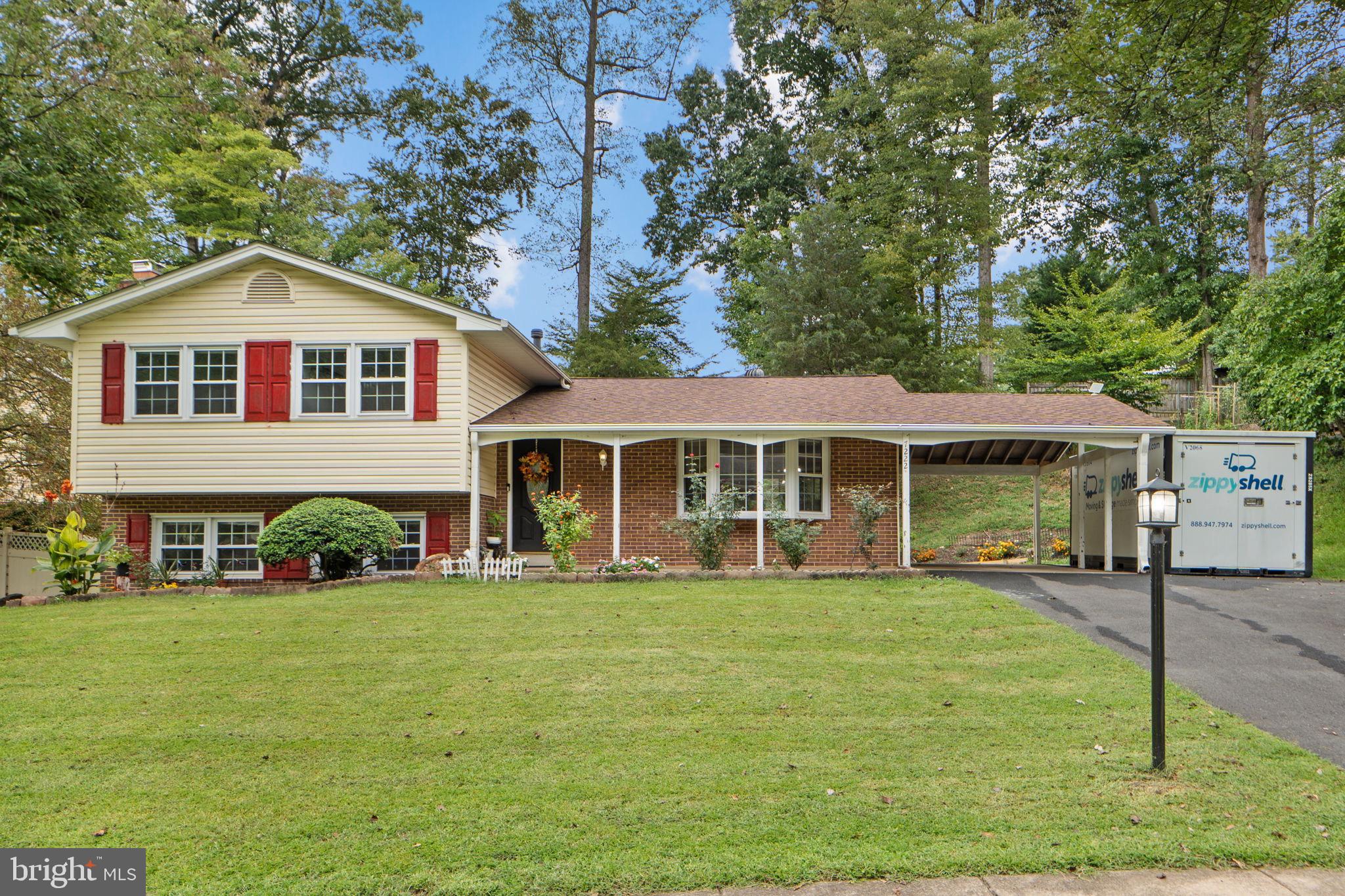 7222 Willow Oak Place Springfield, VA 22153 - Photo 3 of 34 a front view of a house with a yard