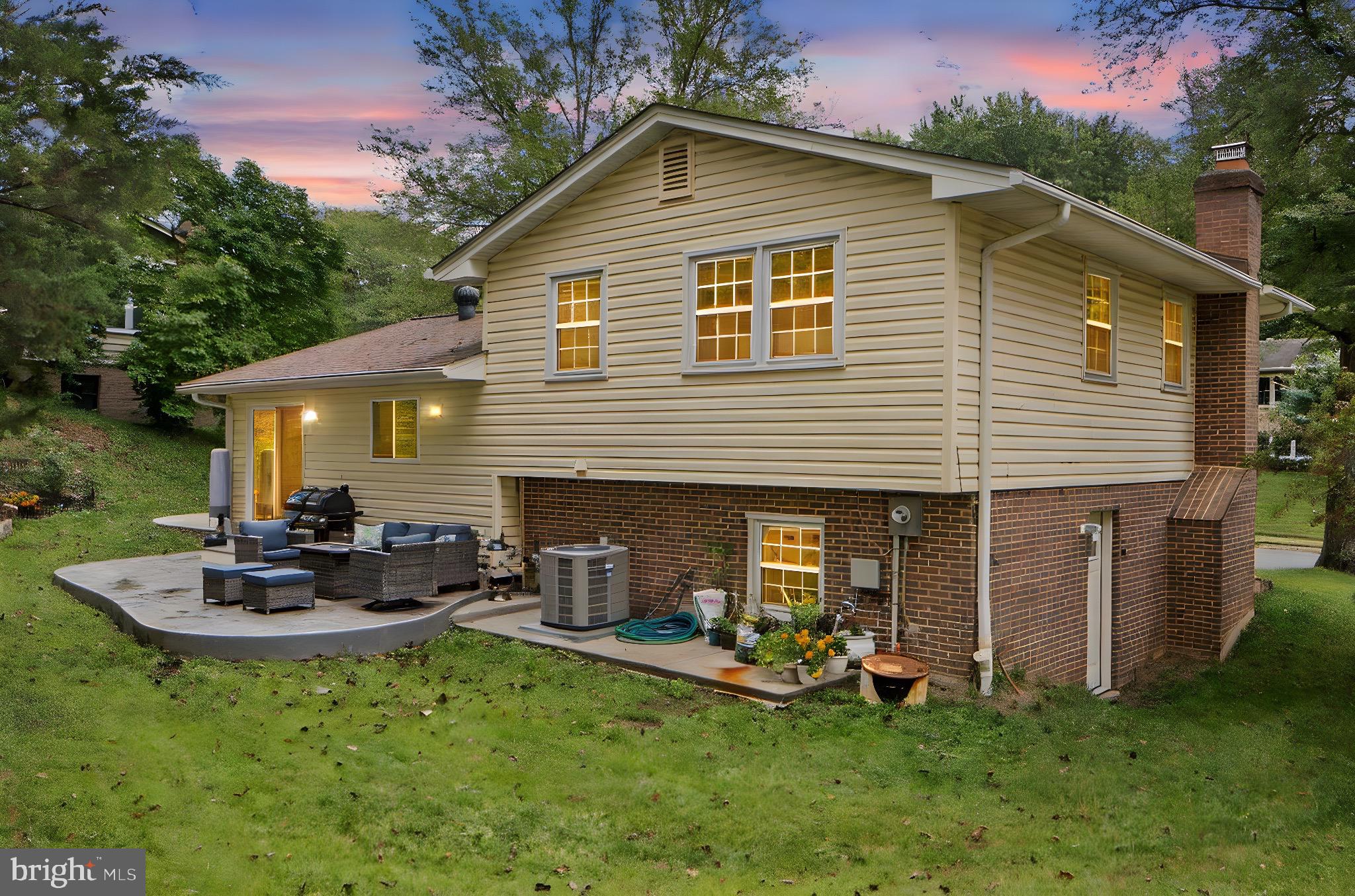 7222 Willow Oak Place Springfield, VA 22153 - Photo 33 of 34 a backyard of a house with garden and outdoor seating