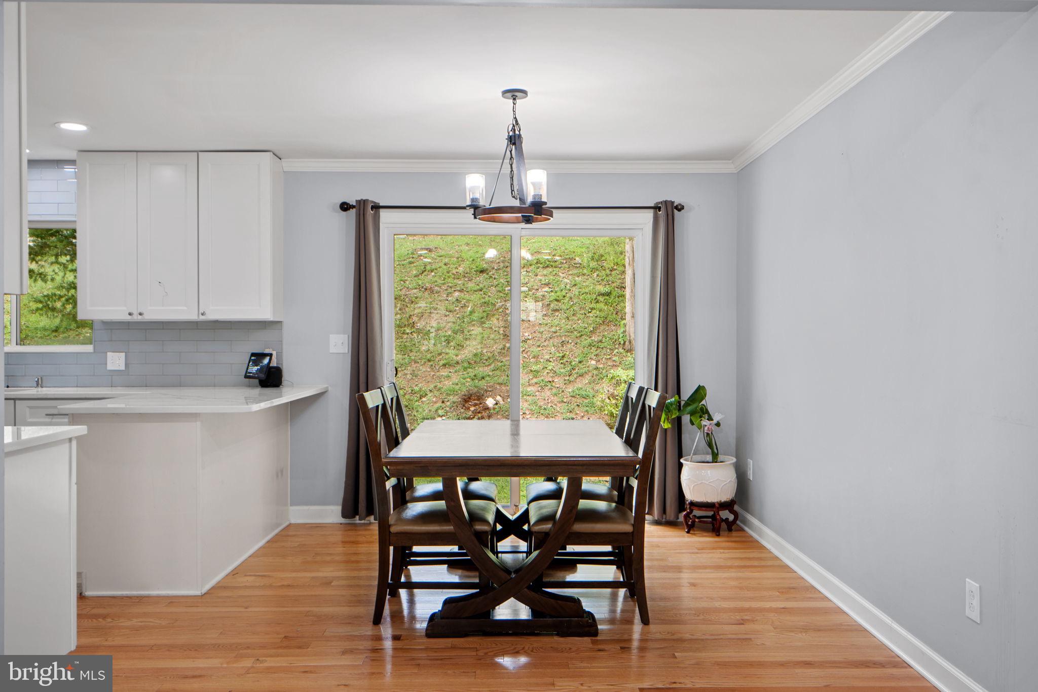 7222 Willow Oak Place Springfield, VA 22153 - Photo 9 of 34 a dining room with furniture and window