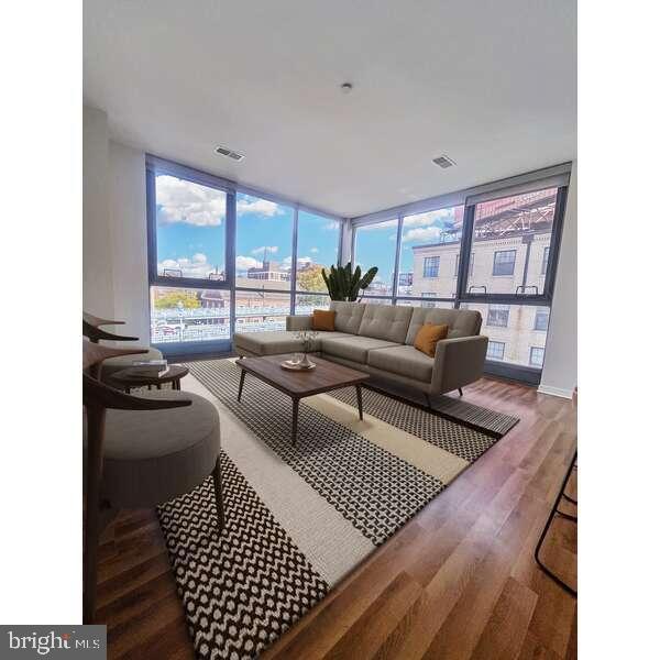 a living room with furniture and a rug