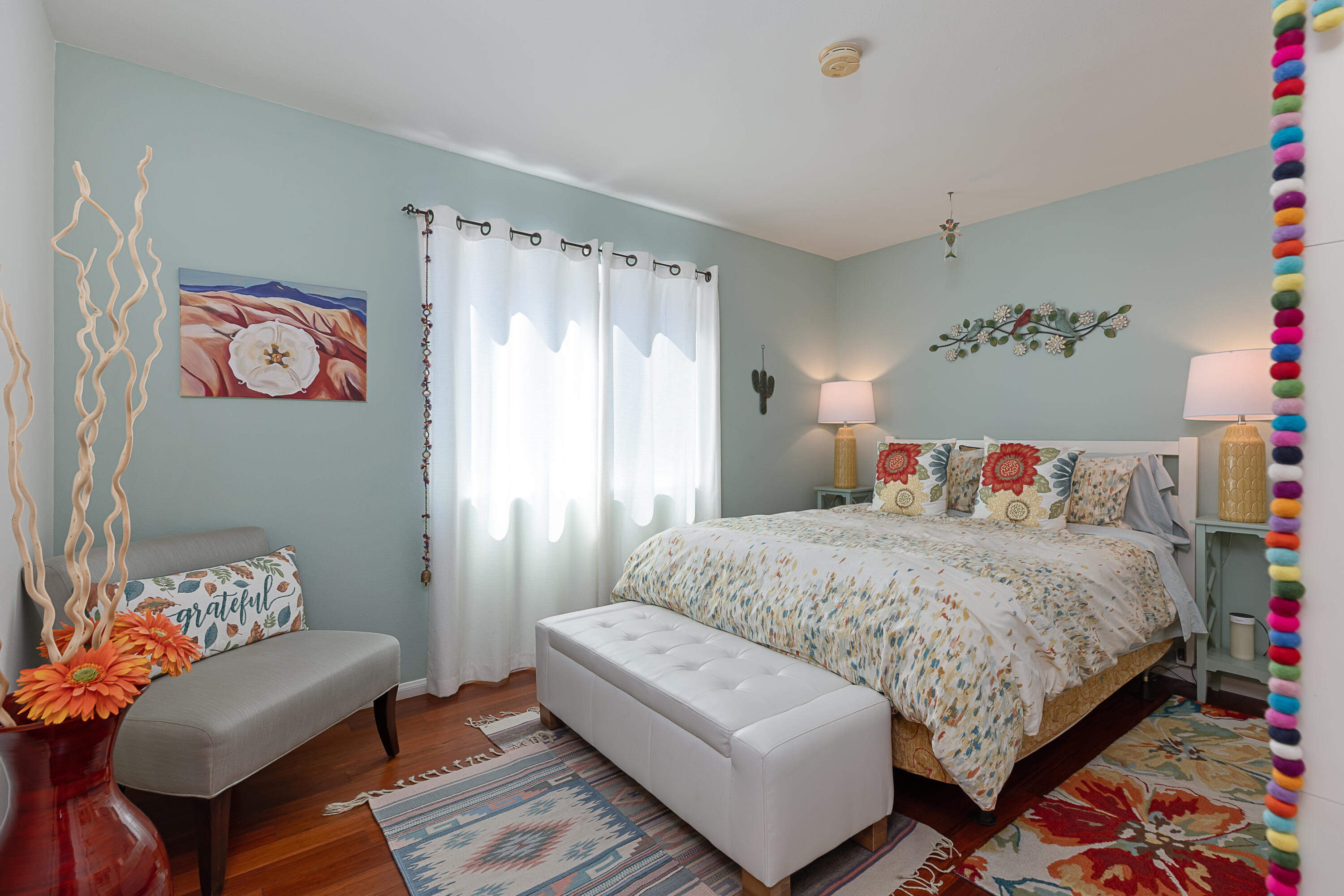 4655 Aragon Drive Carpinteria, CA 93013 - Photo 14 of 32 a bedroom with a bed and a couch