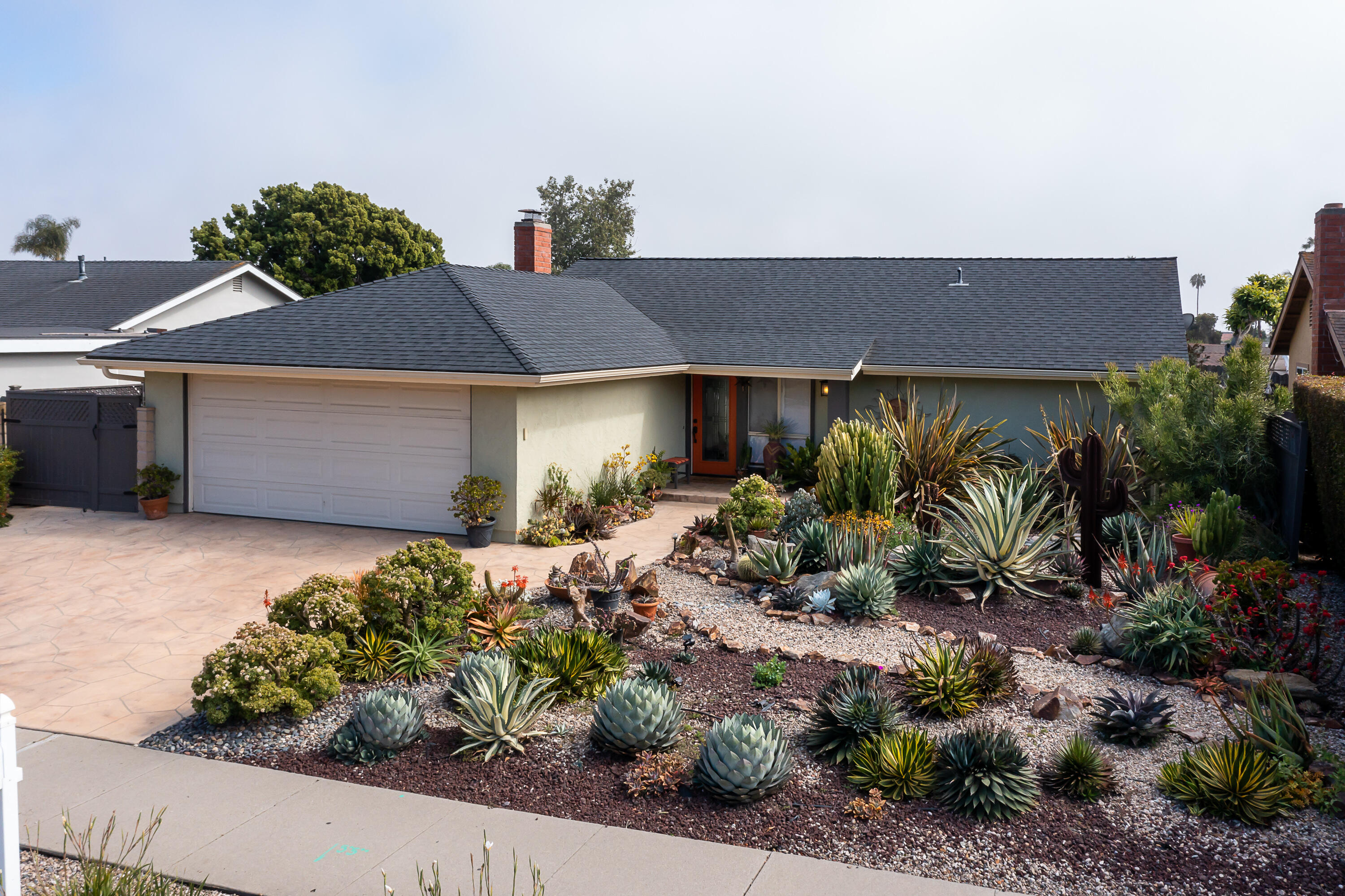 4655 Aragon Drive Carpinteria, CA 93013 - Photo 2 of 32 a front view of a house with a yard