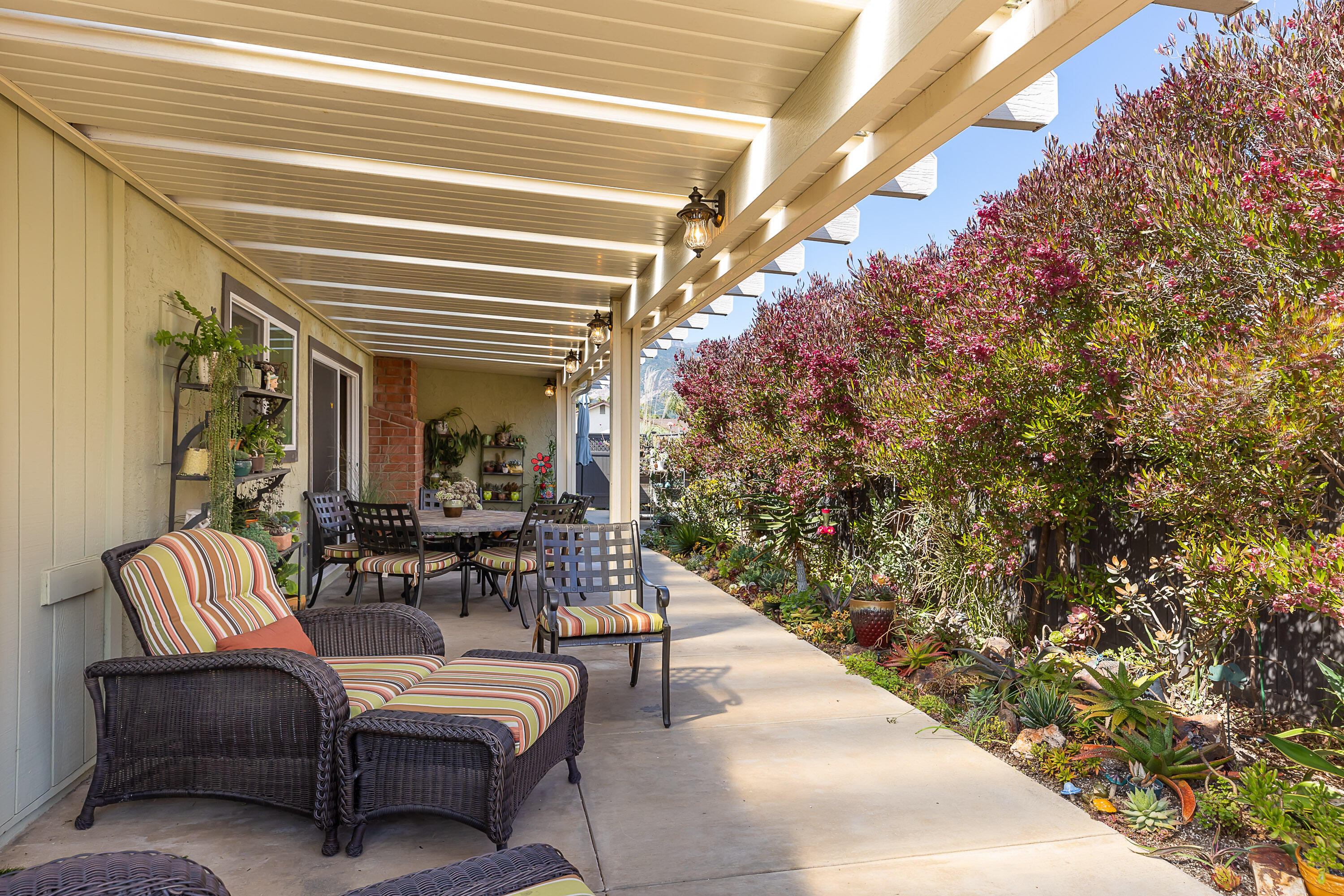 4655 Aragon Drive Carpinteria, CA 93013 - Photo 22 of 32 a view of a porch with furniture and a potted plant