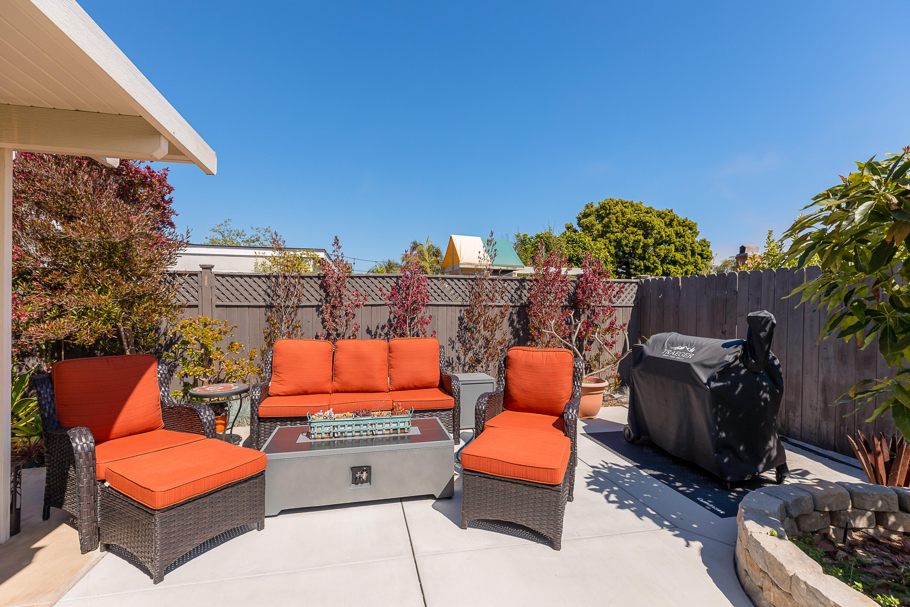 4655 Aragon Drive Carpinteria, CA 93013 - Photo 23 of 32 an outdoor sitting area with a table and chairs