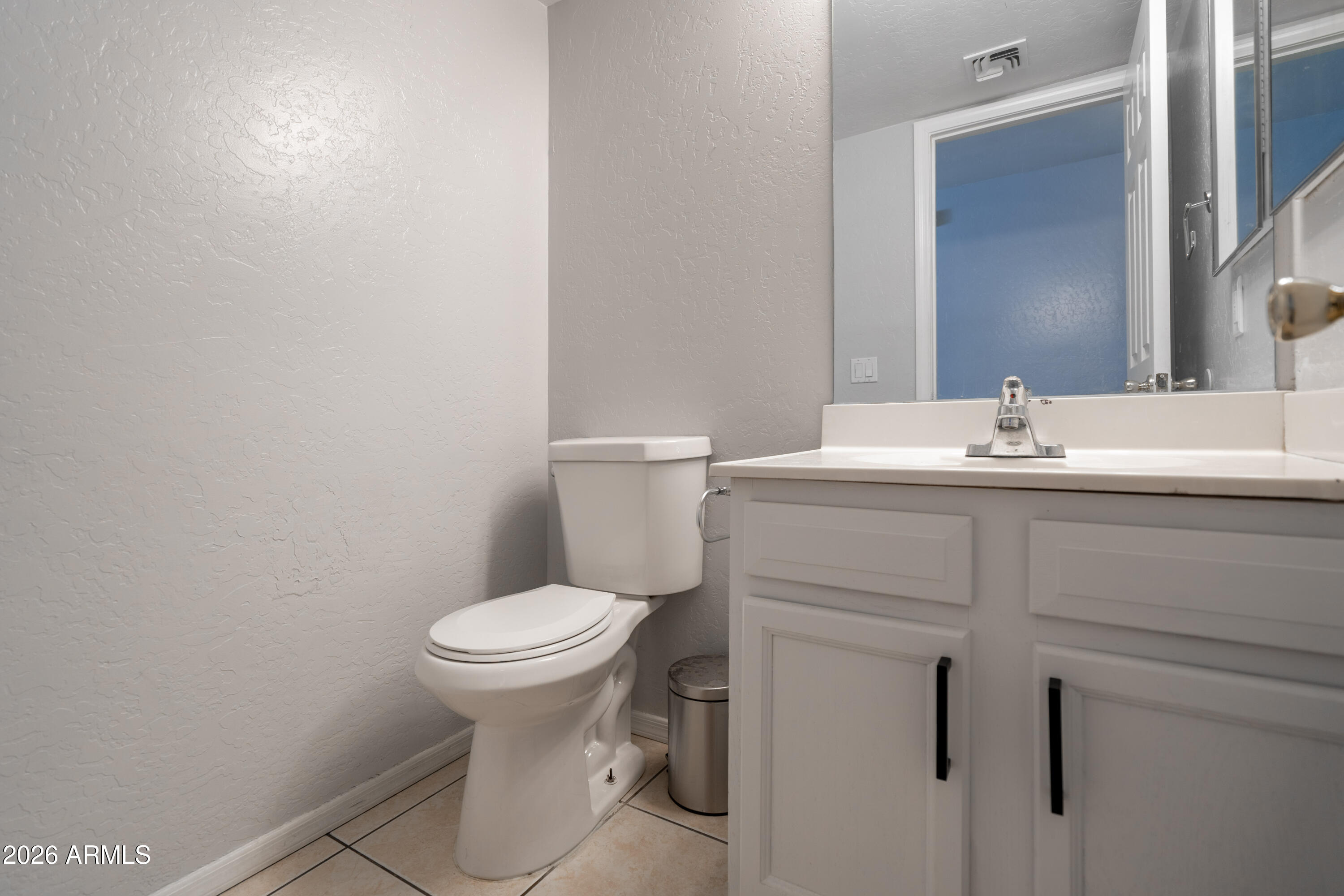 15855 South Moon Valley Road Arizona City, AZ 85123 - Photo 11 of 22 a bathroom with a sink toilet and a mirror