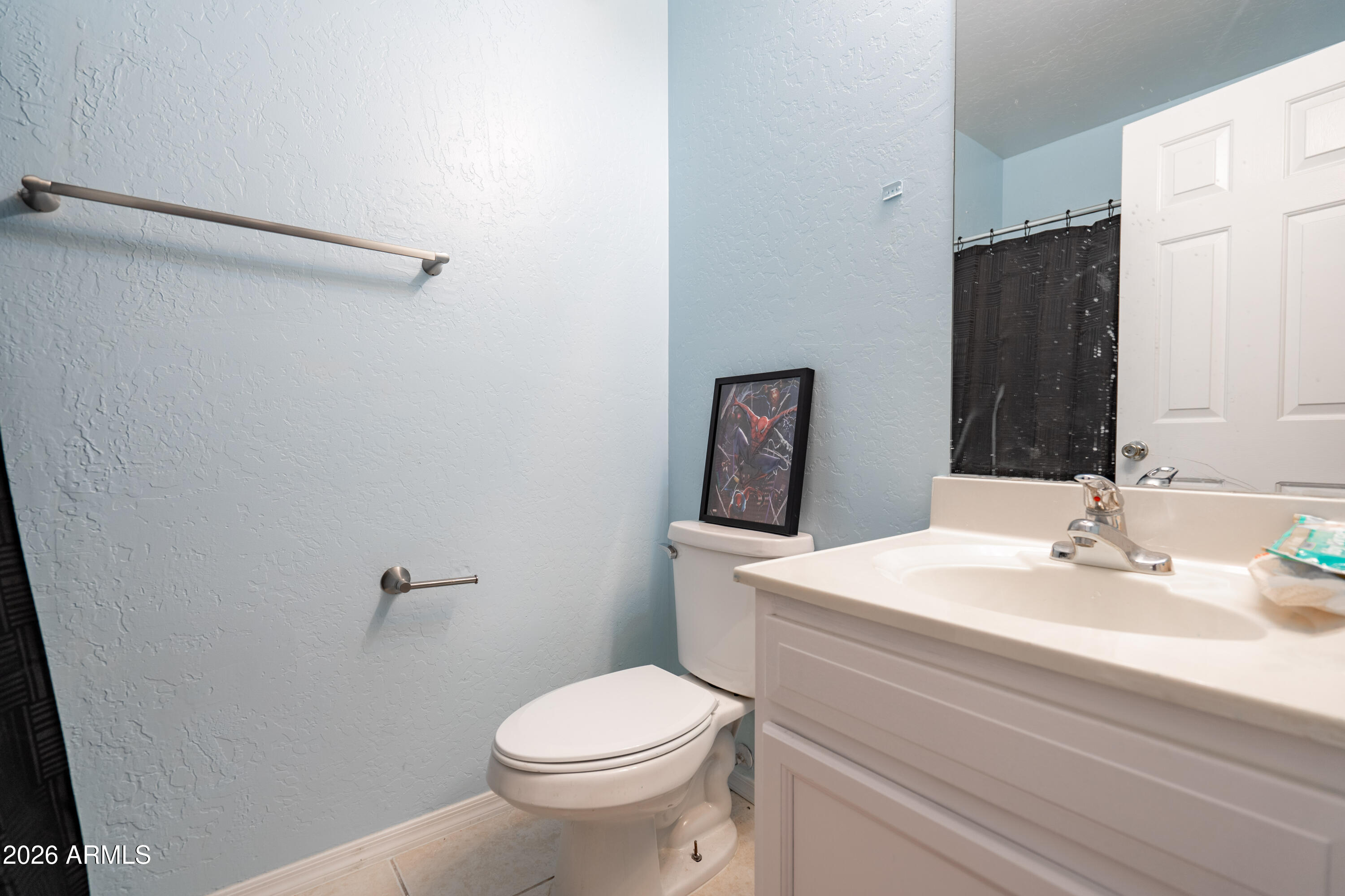 15855 South Moon Valley Road Arizona City, AZ 85123 - Photo 12 of 22 a bathroom with a sink a toilet and mirror