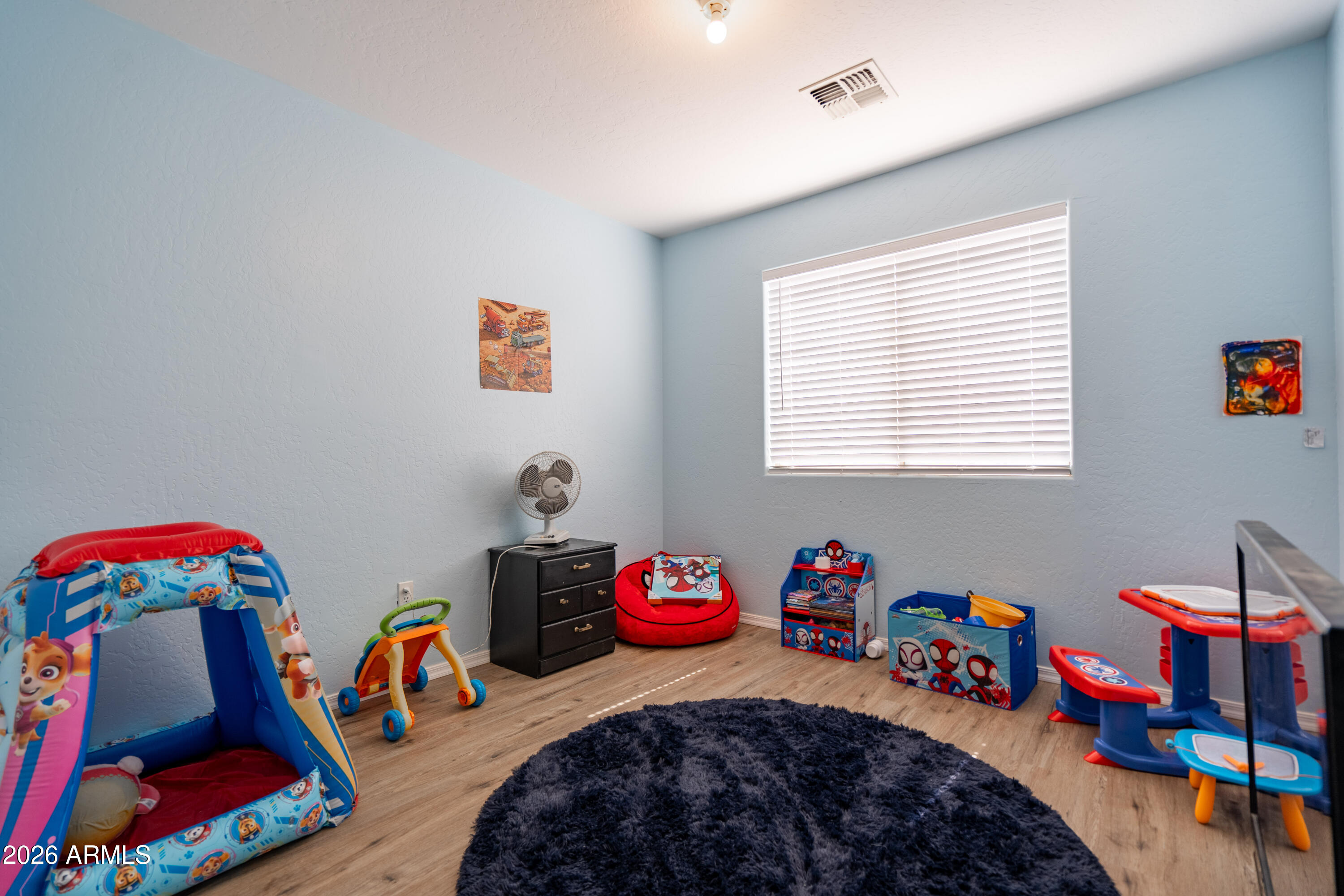 15855 South Moon Valley Road Arizona City, AZ 85123 - Photo 19 of 22 a bedroom with a bed and a window
