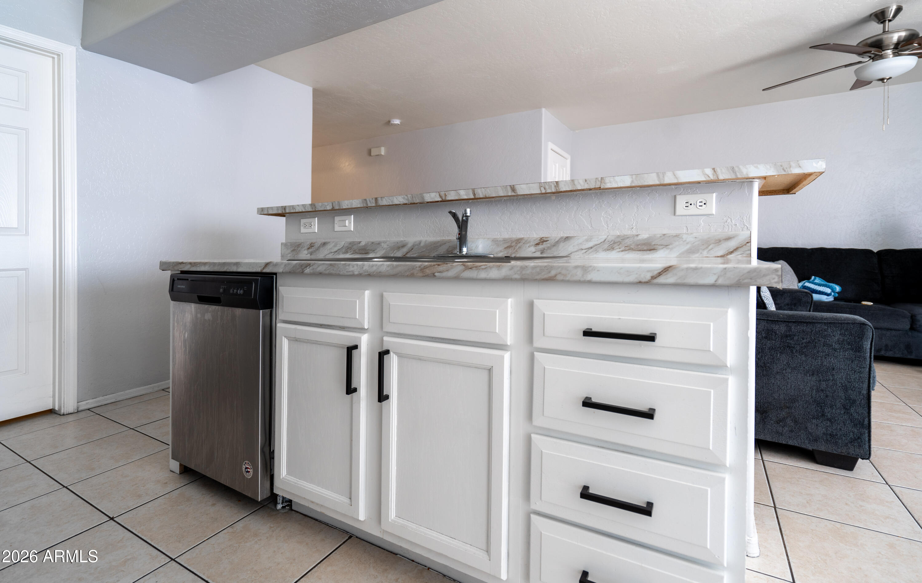 15855 South Moon Valley Road Arizona City, AZ 85123 - Photo 5 of 22 a kitchen with white cabinets and appliances
