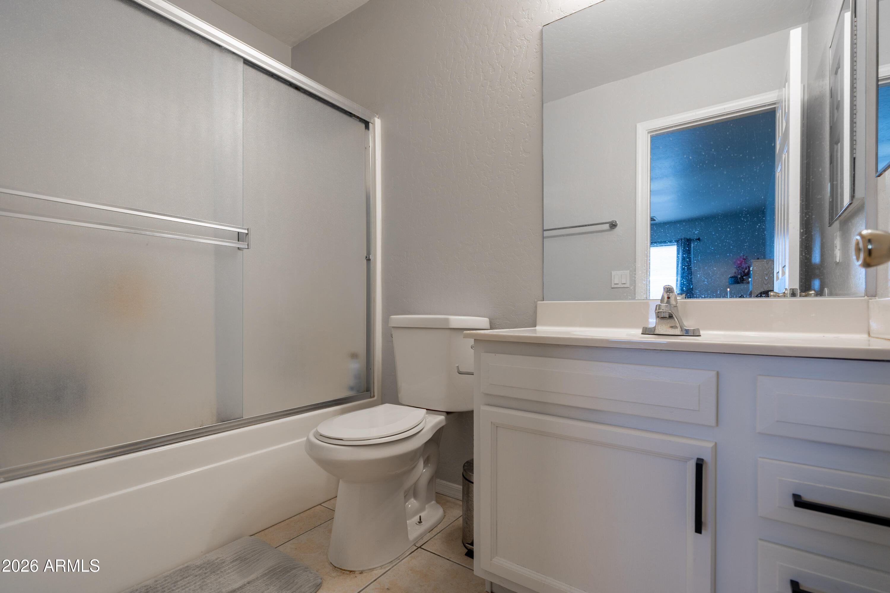 15855 South Moon Valley Road Arizona City, AZ 85123 - Photo 9 of 22 a bathroom with a sink a toilet and a mirror