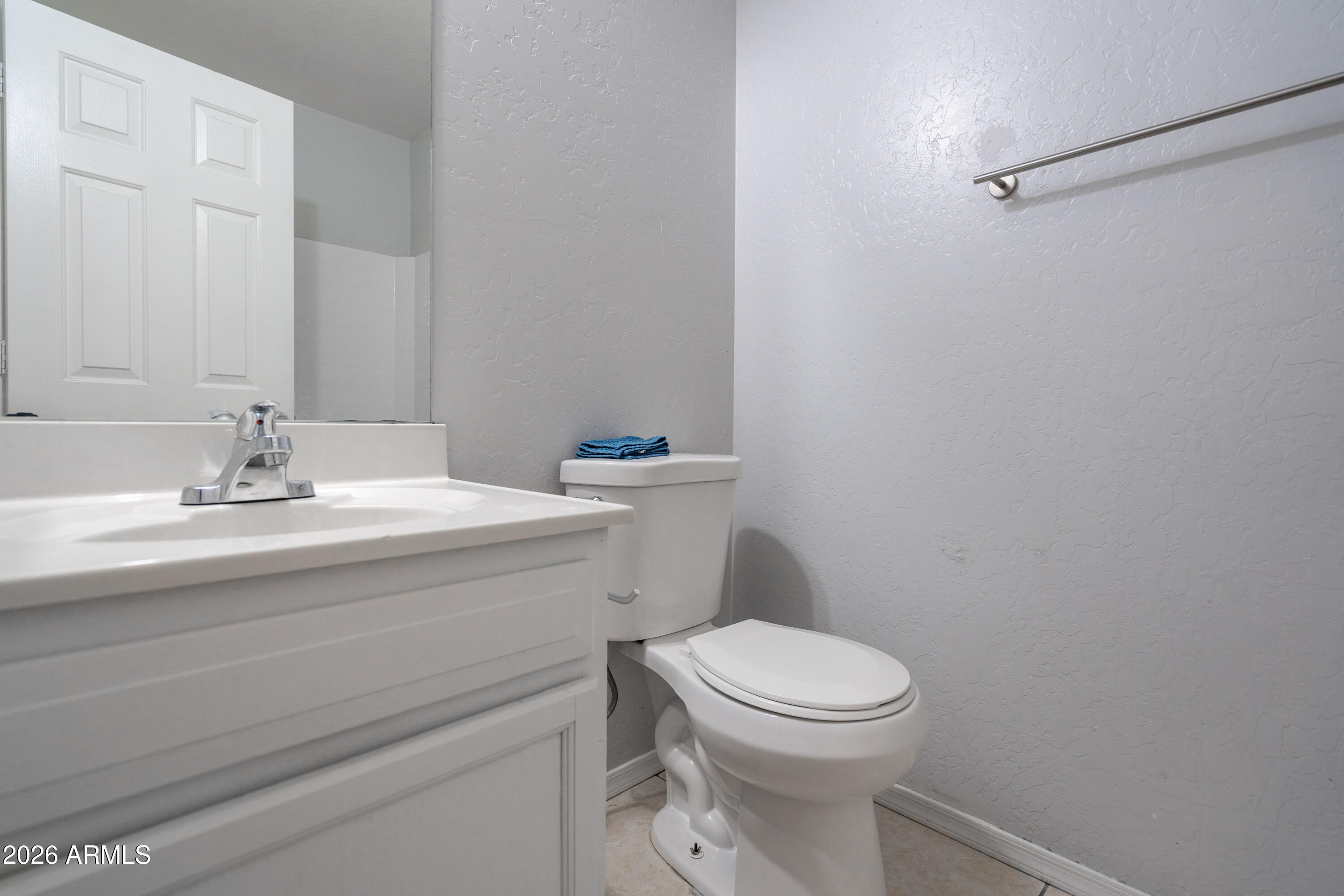 15855 South Moon Valley Road Arizona City, AZ 85123 - Photo 10 of 22 a bathroom with a sink a toilet and a mirror