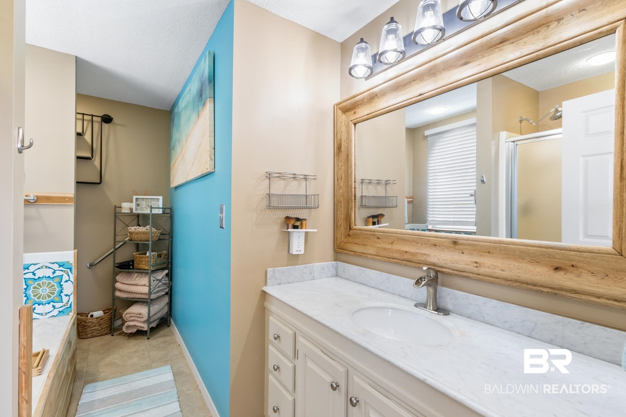 328 Windmill Ridge Road Gulf Shores, AL 36542 - Photo 21 of 47 Bathroom with tile patterned floors, walk in shower, and vanity