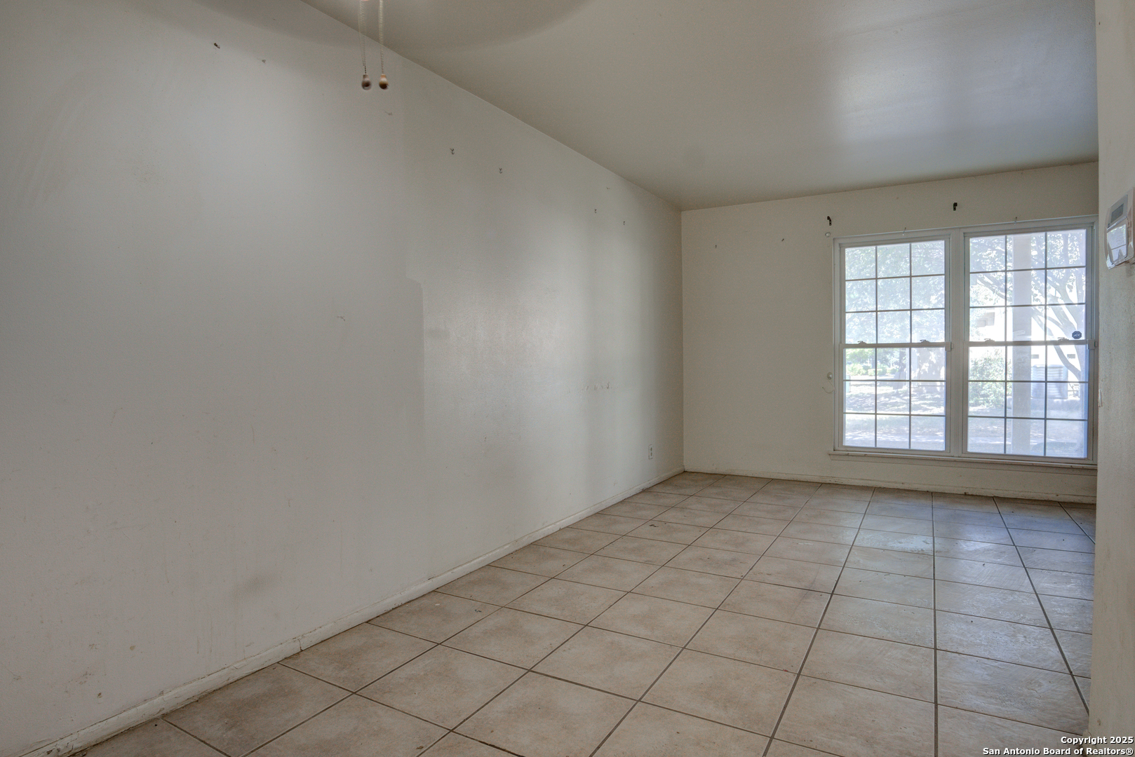 8702 Village Drive, Unit BLDG 8 814 San Antonio, TX 78217 - Photo 16 of 25 an empty room with windows