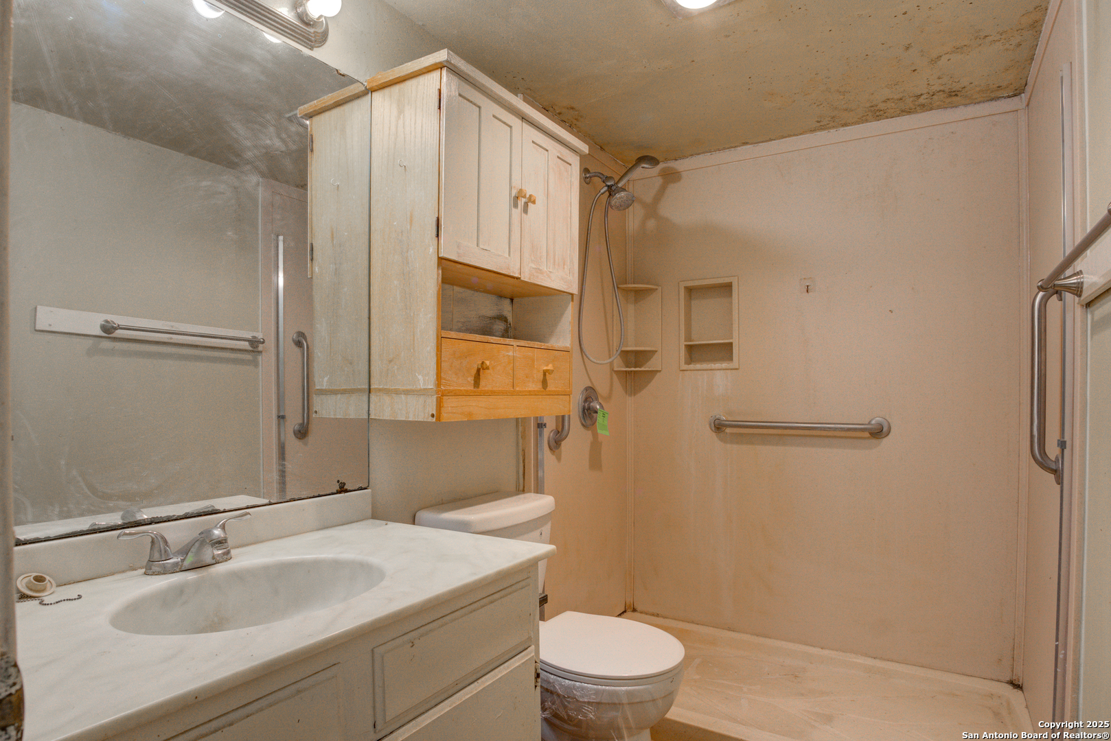 8702 Village Drive, Unit BLDG 8 814 San Antonio, TX 78217 - Photo 18 of 25 a bathroom with a sink a toilet and shower