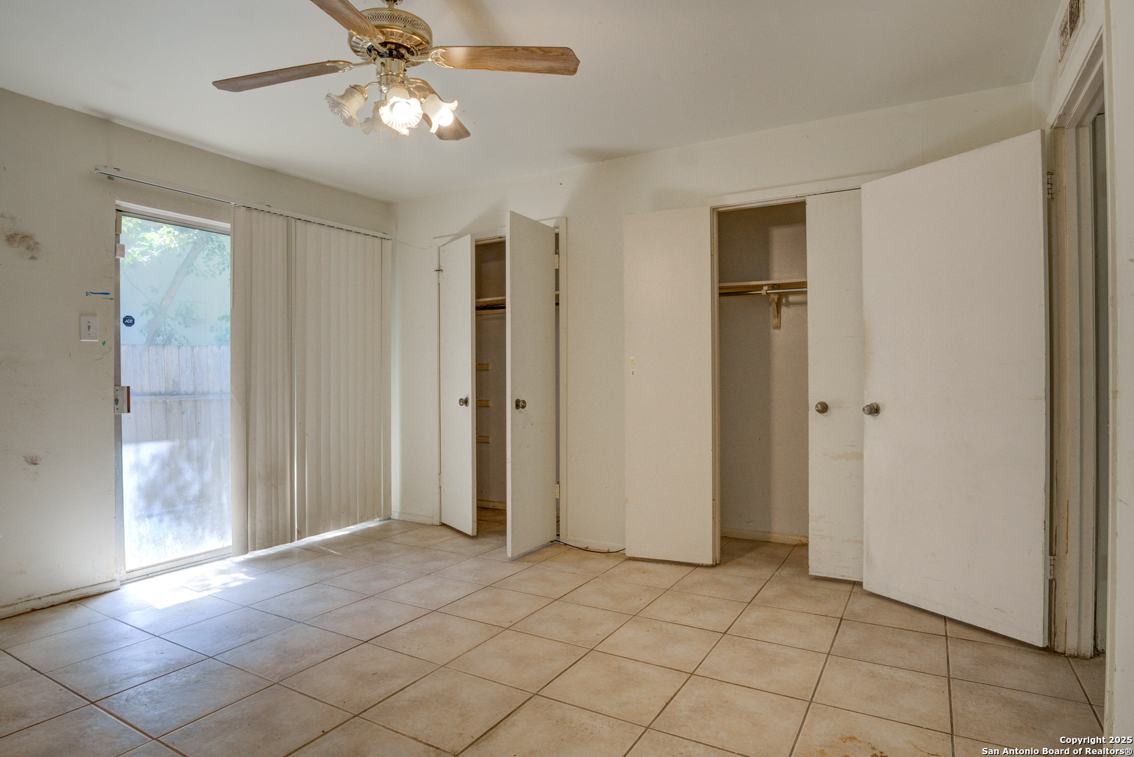 8702 Village Drive, Unit BLDG 8 814 San Antonio, TX 78217 - Photo 20 of 25 a view of a livingroom with a chandelier fan and windows