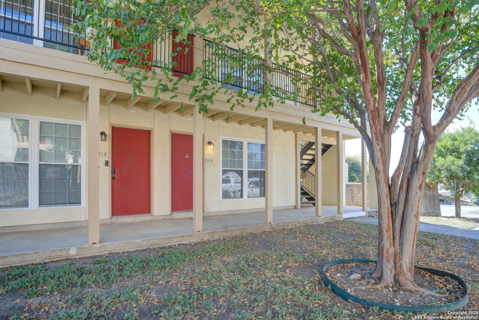 8702 Village Drive, Unit BLDG 8 814 San Antonio, TX 78217 - Photo 3 of 25 a front view of a house with a yard